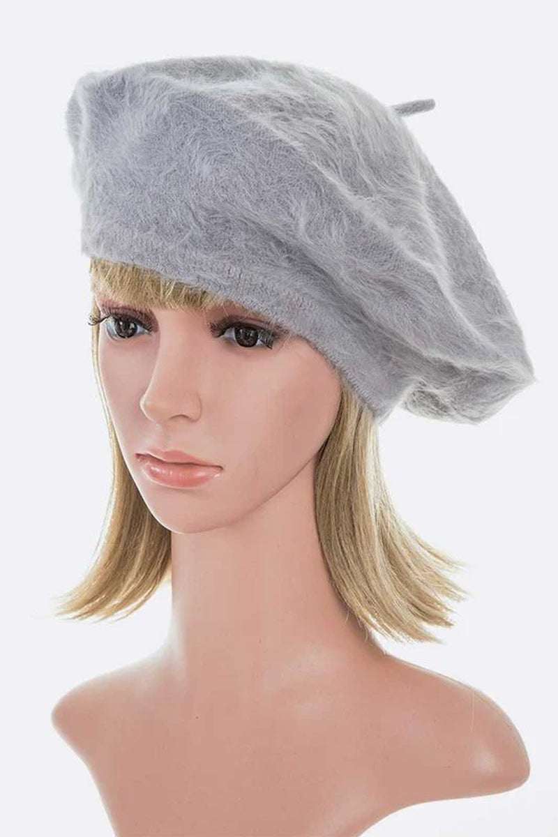 Stylish gray faux fur winter beret displayed on a mannequin, perfect for adding elegance to winter outfits.