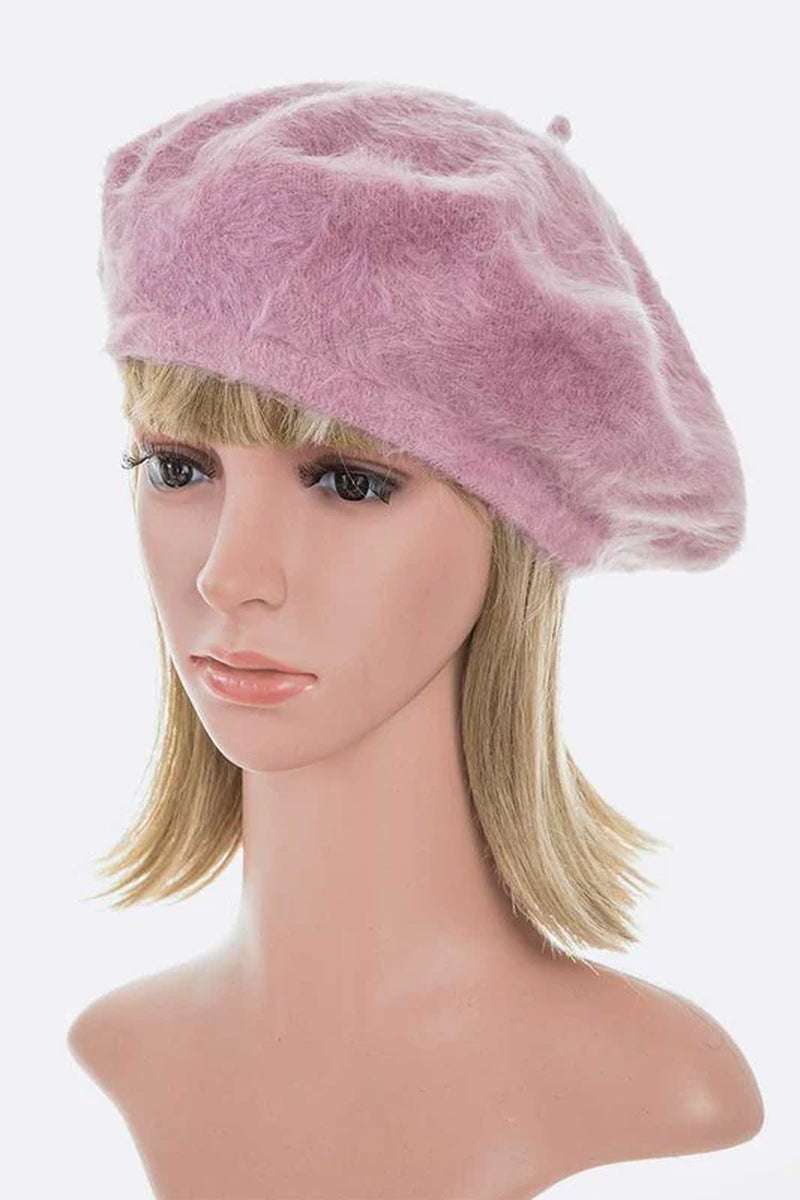 Stylish pink faux fur winter beret showcased on a mannequin, exuding elegance and cozy warmth for chic winter fashion.