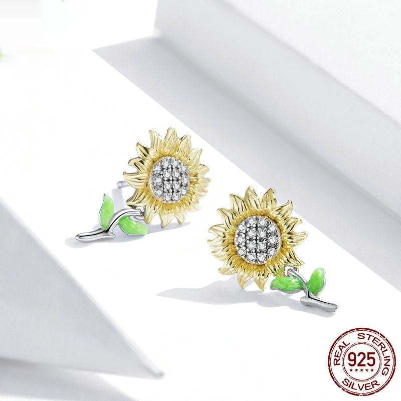 Sunflower S925 silver stud earrings with gold plating and green leaf detail