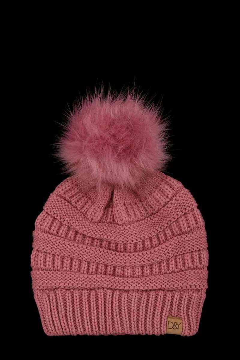 Super soft halo ripped faux fur pom beanie in pink with fluffy pom pom detail, perfect for stylish winter wear.