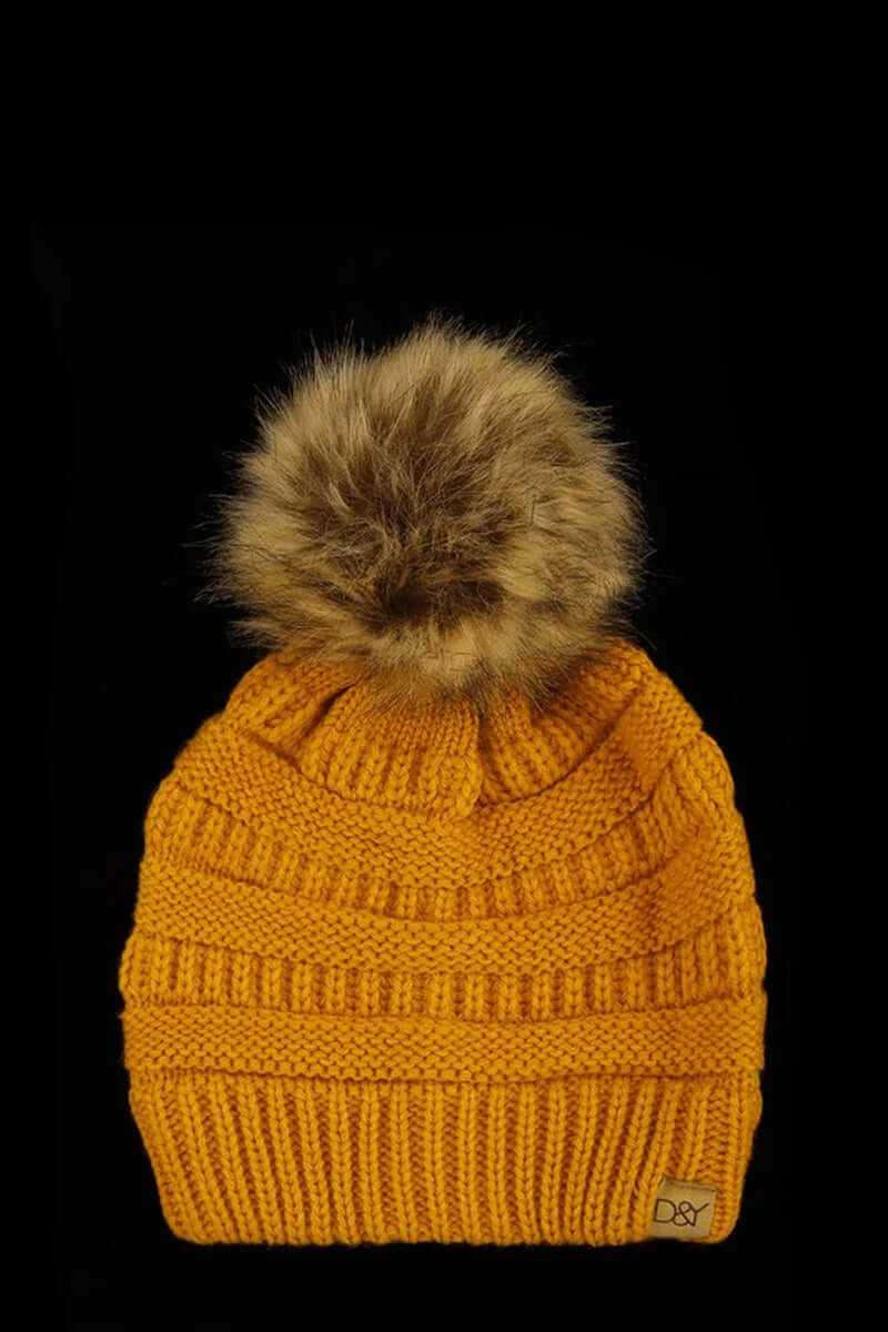 Super soft halo ripped faux fur pom beanie in vibrant mustard yellow with a fluffy pom detail.