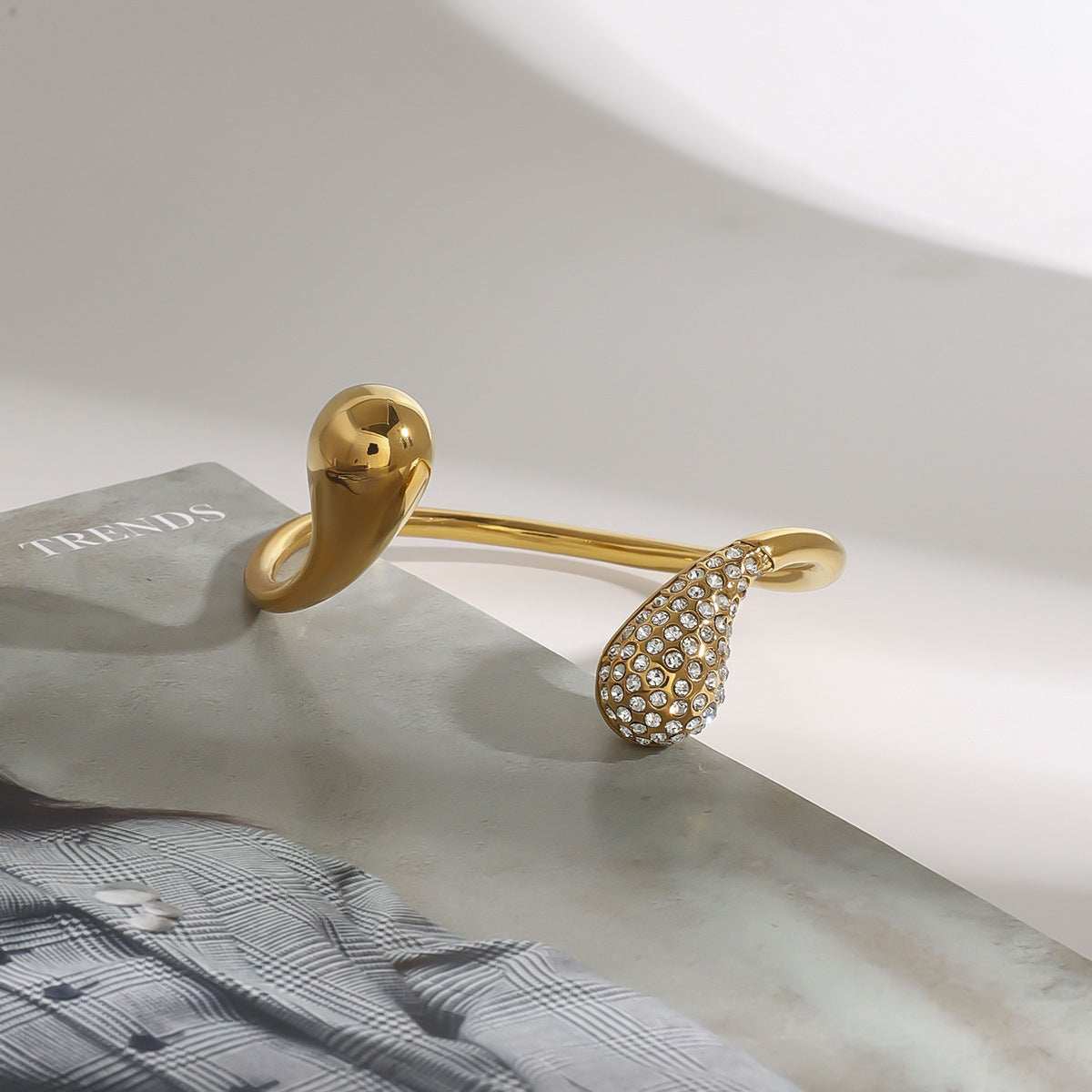 Gold titanium steel bracelet with diamond water drop design and electroplated finish