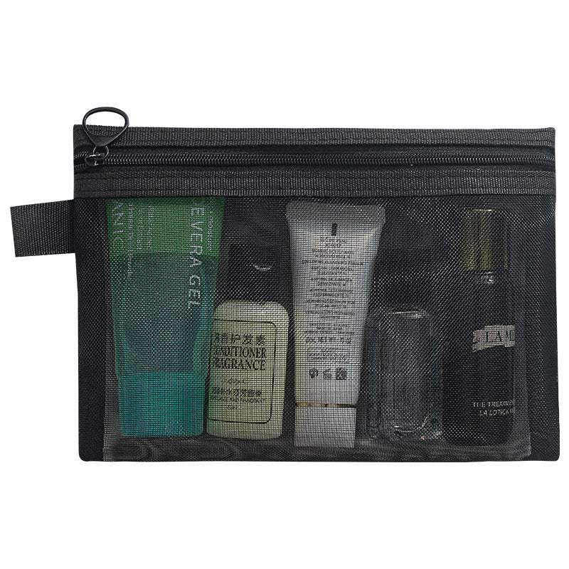 Black transparent mesh makeup organizer bag with zipper and handle, holding travel-size cosmetic bottles and tubes