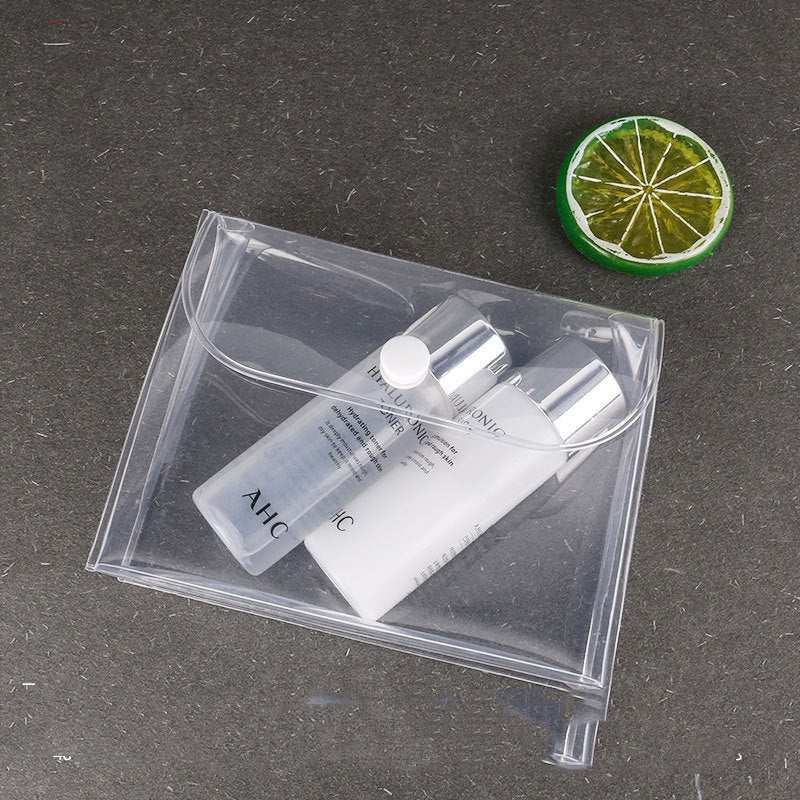 Transparent waterproof cosmetics travel kit with clear EVA plastic and button closure storing two cosmetic bottles on dark surface