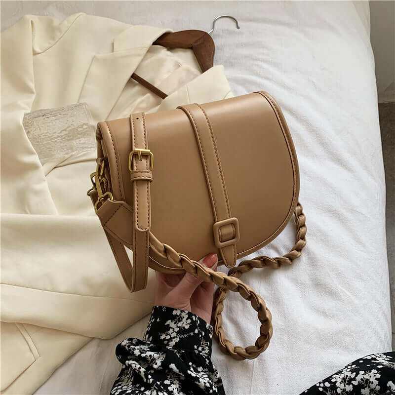 Stylish PU women's saddle messenger purse in beige, showcasing braided strap, perfect for modern fashion.