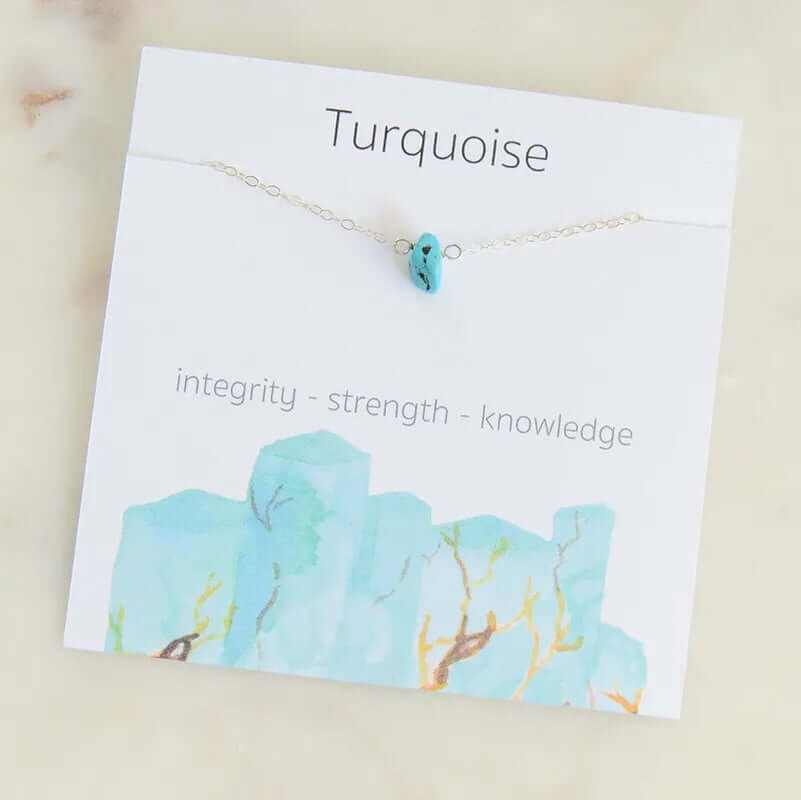Turquoise charm necklace on a card featuring integrity, strength, and knowledge with a soft watercolor design.