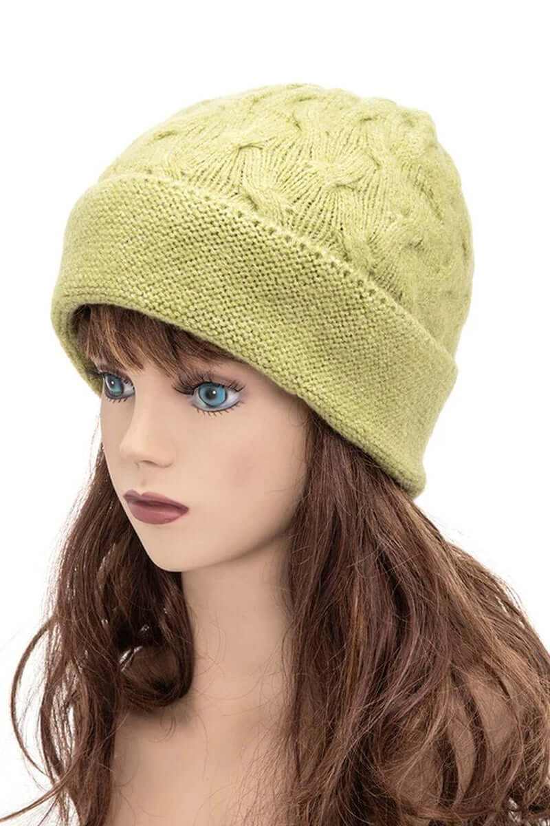 Unisex slouchy fit soft knit beanie in light green, offering cozy style for cooler seasons.