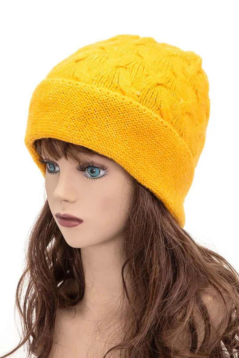 Unisex slouchy fit soft knit beanie in bright yellow displayed on a mannequin model for stylish winter wear.