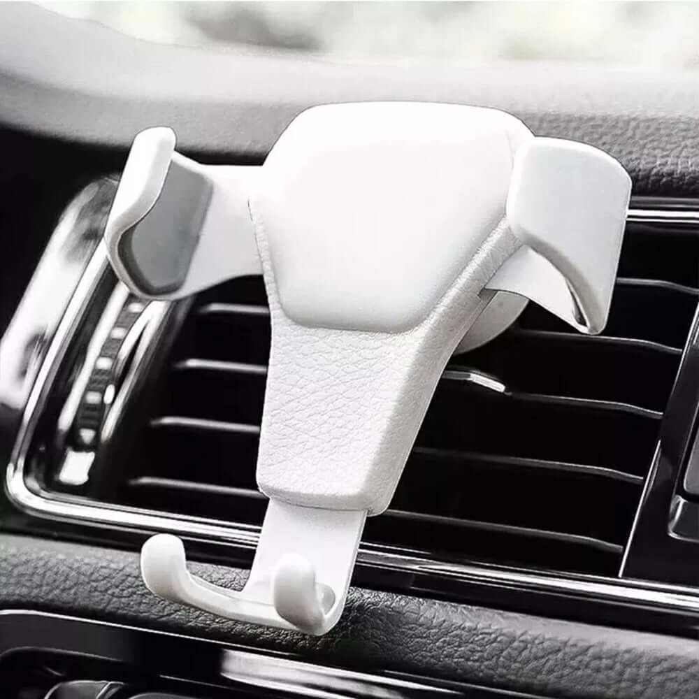 White universal gravity phone holder mounted on car air vent for secure smartphone support.
