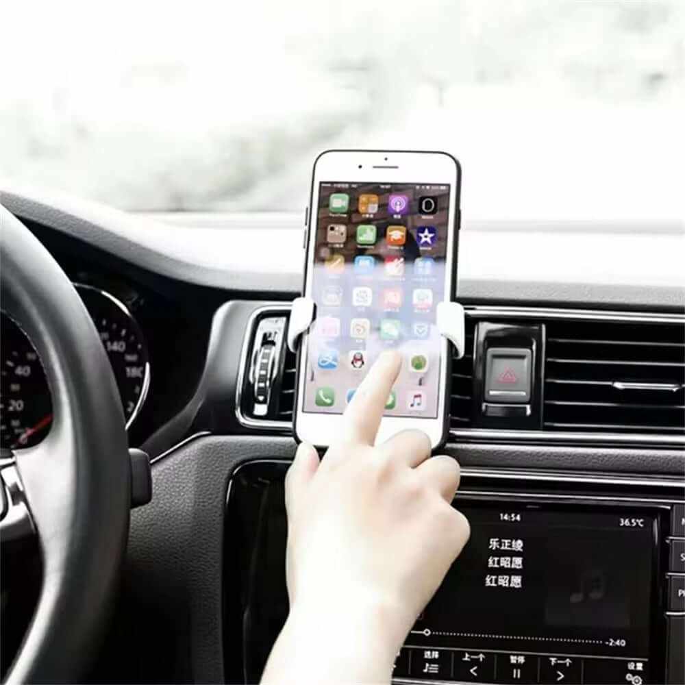 User easily accesses smartphone in a car air vent mount, showcasing intuitive one-hand operation and secure attachment.