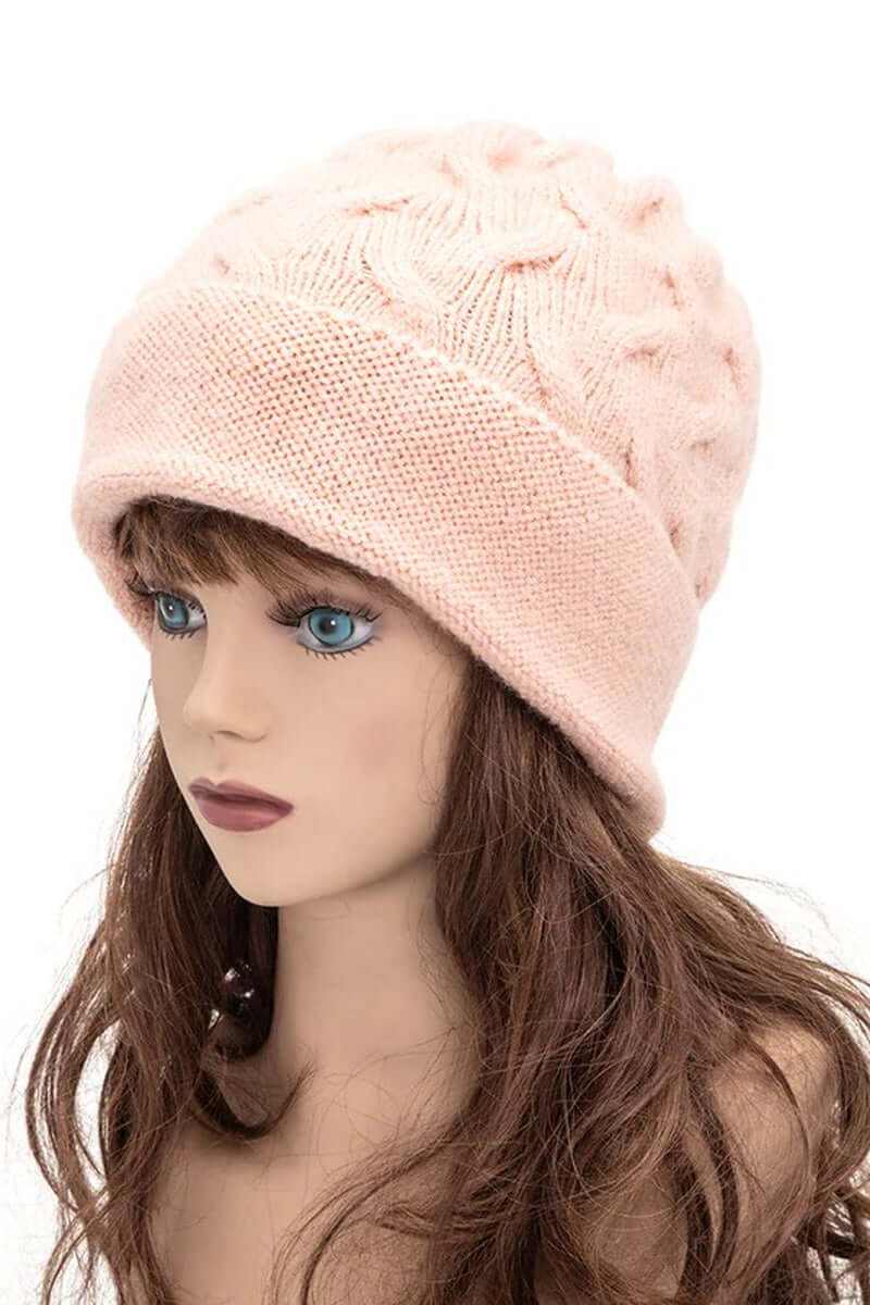 Warm slouchy pink wool blend cuffed beanie worn by a mannequin, perfect for winter fashion and cozy comfort.