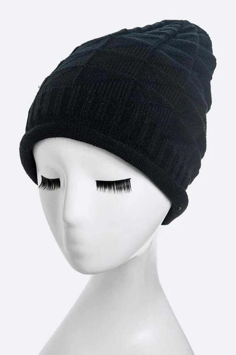 Warm ribbed unisex raised knit slouchy beanie displayed on a mannequin head, perfect for stylish winter wear.