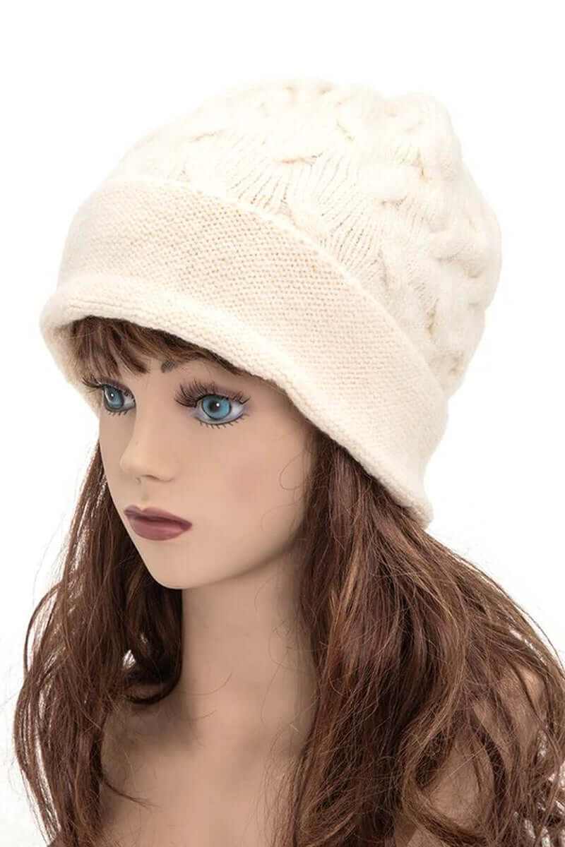 Warm slouchy wool blend cuffed beanie displayed on a mannequin, showcasing cozy winter style.