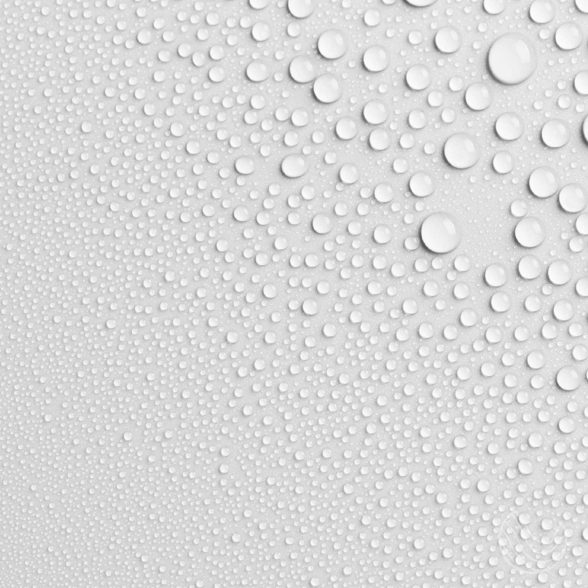 Close-up of droplets on a smooth surface, showcasing water texture and reflections.