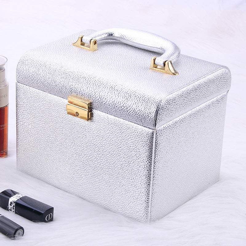 Silver water-resistant outdoor makeup case with handle and gold clasp