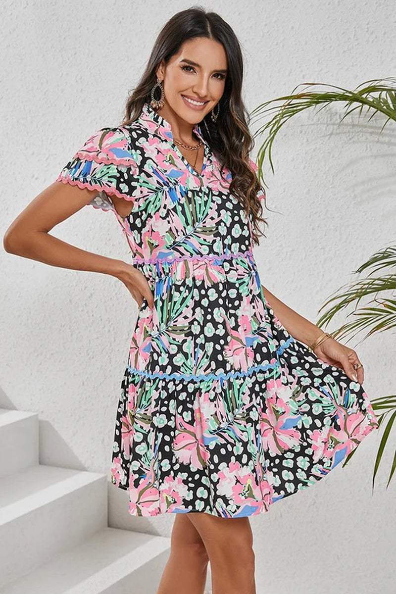 Women Floral Ricrac Embellished Tiered Mini Dress in vibrant floral print, perfect for summer styling.
