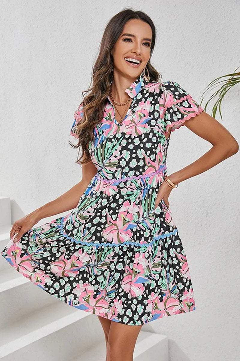 Women Floral Ricrac Embellished Tiered Mini Dress in vibrant colors, featuring a playful design and short sleeves.