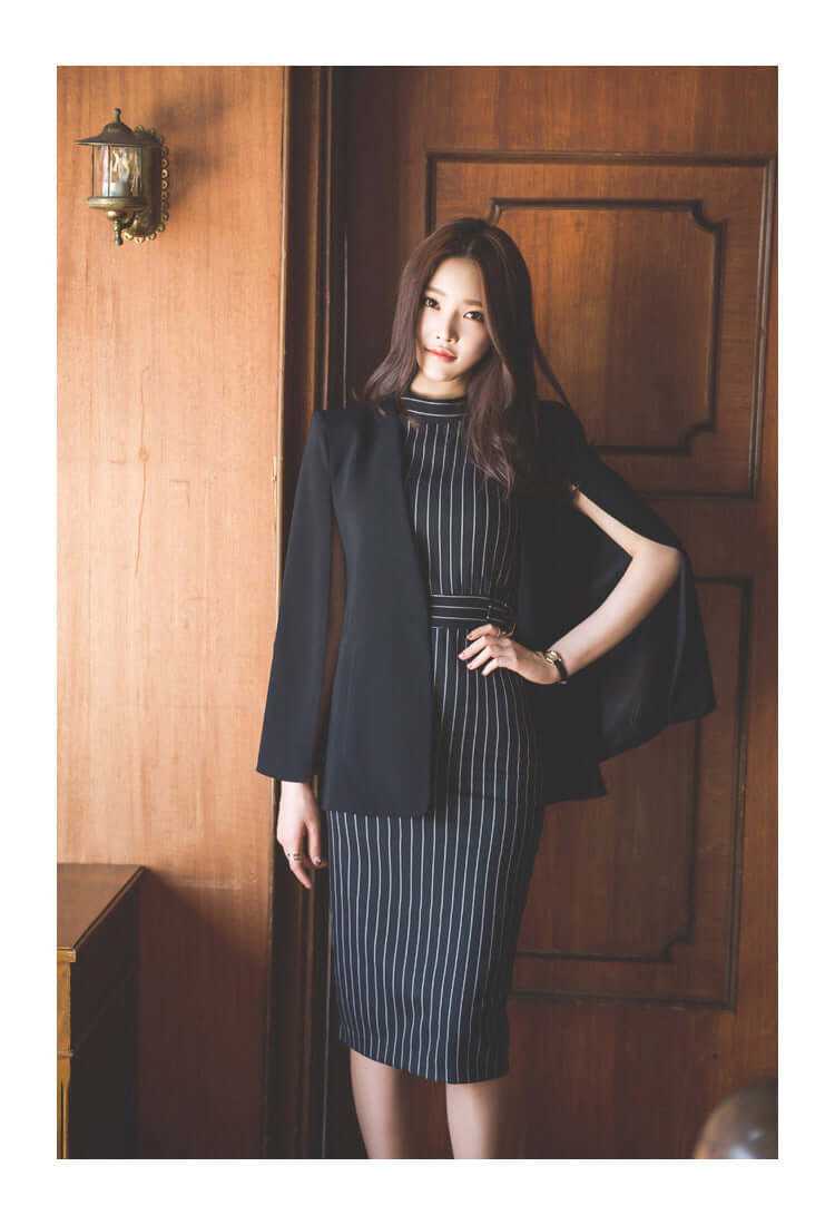 Elegant woman wearing a striped fitted dress with a blazer, perfect for office and autumn events.