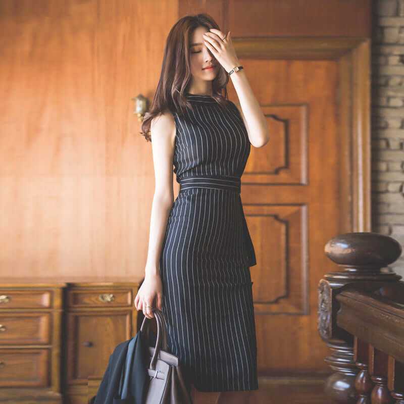 Stylish black and white striped women dress, perfect for autumn office wear and spring occasions.