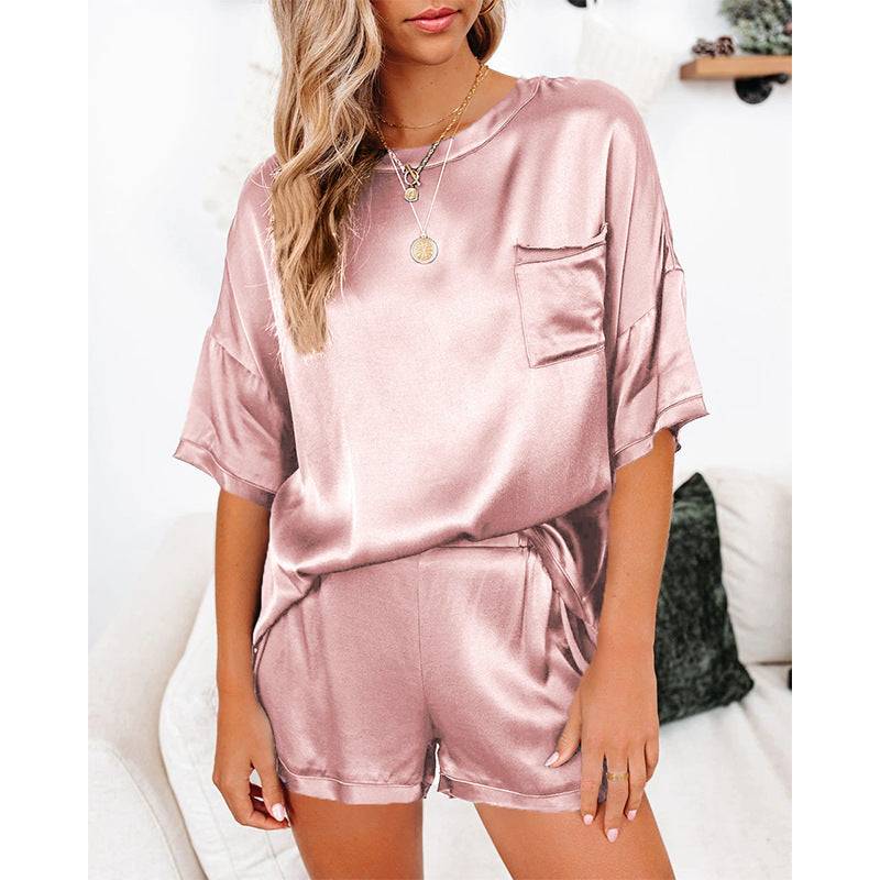 Short sleeve silk pajama set in pink for women, featuring a T-shirt and shorts, perfect for home leisure wear.