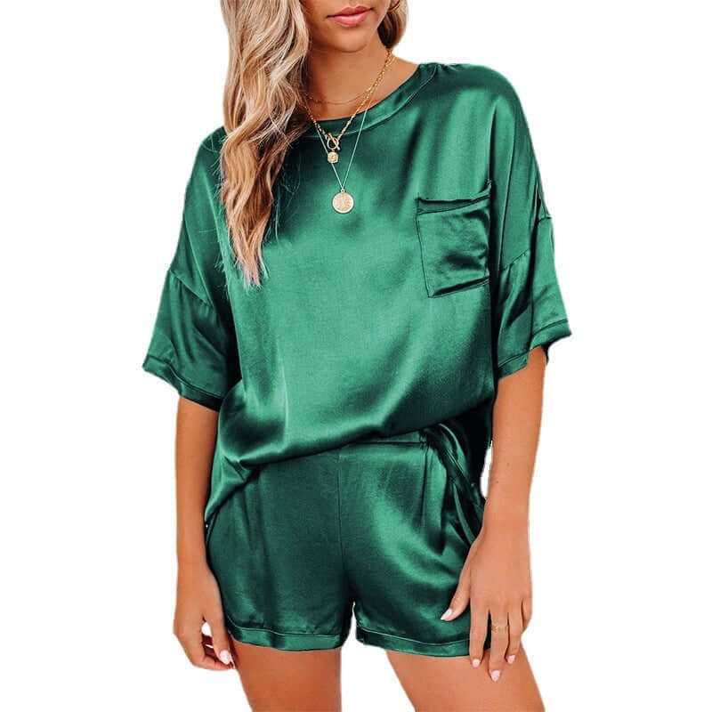 Green silk short sleeve pajama set for women featuring relaxed T-shirt and shorts, perfect for home sleepwear.