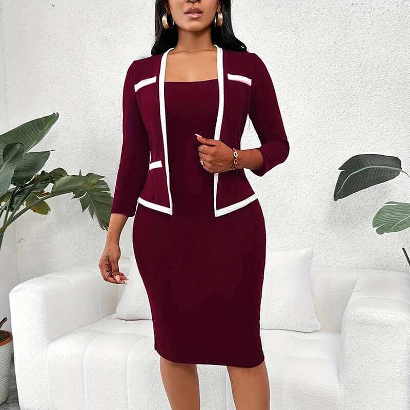 Woman wearing burgundy mock two-piece office dress with white trim and half sleeves