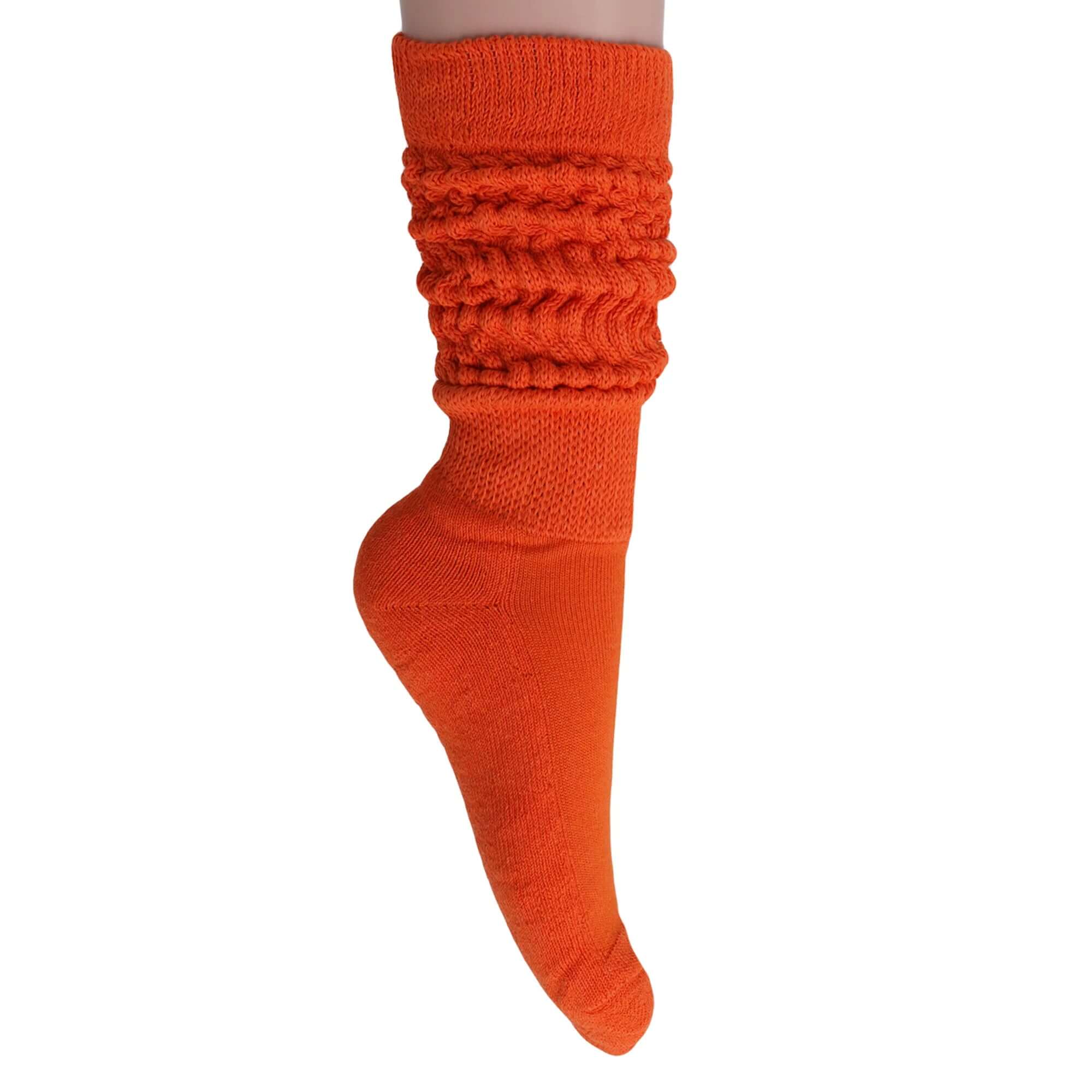 Bright orange slouchy scrunch sock made of soft cotton, perfect for a retro-chic style.