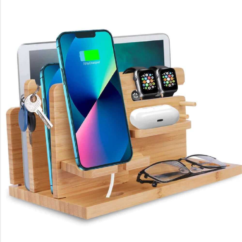 Wooden phone accessory organizer with slots for phone, tablet, glasses, and smartwatch, highlighting natural wood design.